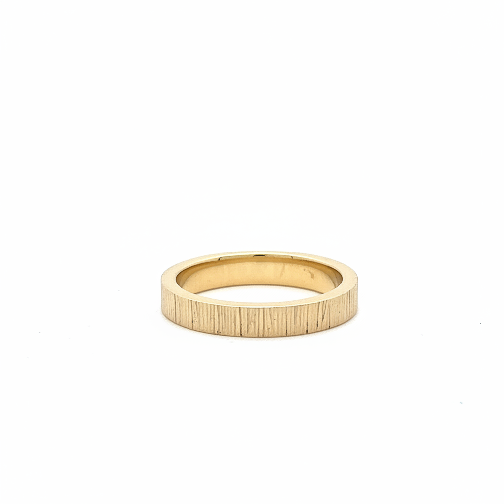 The solid 18kt gold has a weight that grounds you in the present moment while its texture reminds you of the past that shaped you. Each mark tells a story of transformation, of resilience, of becoming more beautiful through experience rather than despite of it. Unlike perfectly smooth bands that deny the reality of time and touch, the Kintsugi Band embraces the poignant awareness of impermanence that makes life's beauty more precious because it cannot last unchanged.