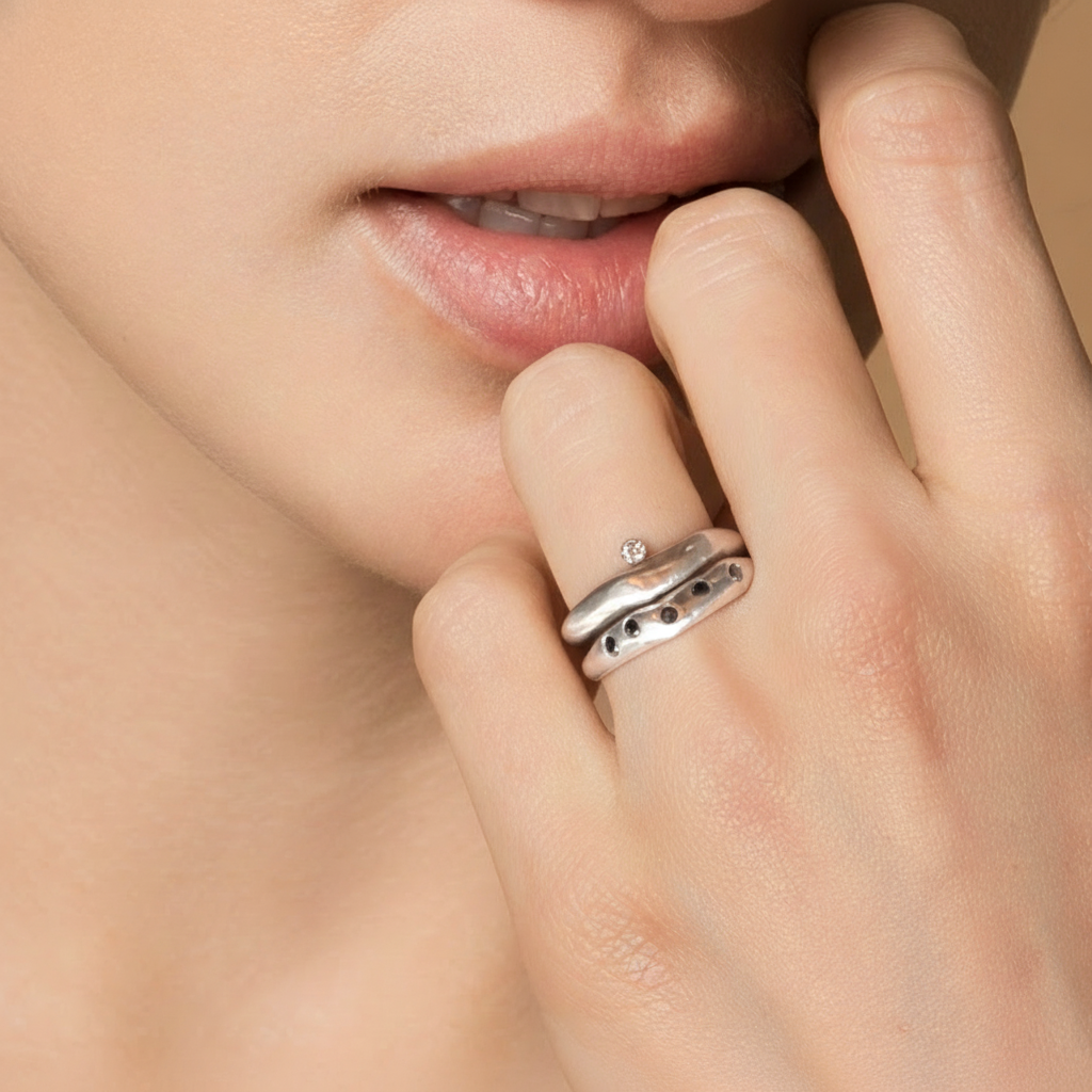 Model wearing Odyssey Ring in Silver and Constellation Ring in Silver