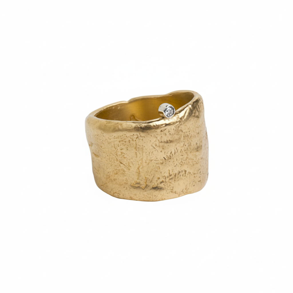 The Relic Ring sets a reminder to dive fearlessly and discover the treasure that lies inside you. It's the perfect ring to help you feel confident and empowered.  With a wide band (which is deceptively comfortable) and bezel set white diamond it makes the Relic Ring a modern antiquity. One that you will wear everyday!