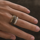Trinity Ring Stack with Ritual Noir Ring on hand