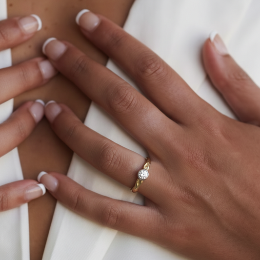 Our 18kt gold Shinrai Ring honors unbreakable connections, re-imagining our beloved Devotion design through the lens of Japanese spiritual tradition.
At its heart rests a brilliant white diamond - available in 4mm / 5mm / or 6mm. It represents the pure light that emerges when we fully commit ourselves to a person, a path, or a purpose. The stone is held in our signature bold setting that doesn't merely display the diamond but embraces it.