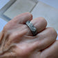 Solar Terrain Ring in silver on persons hand