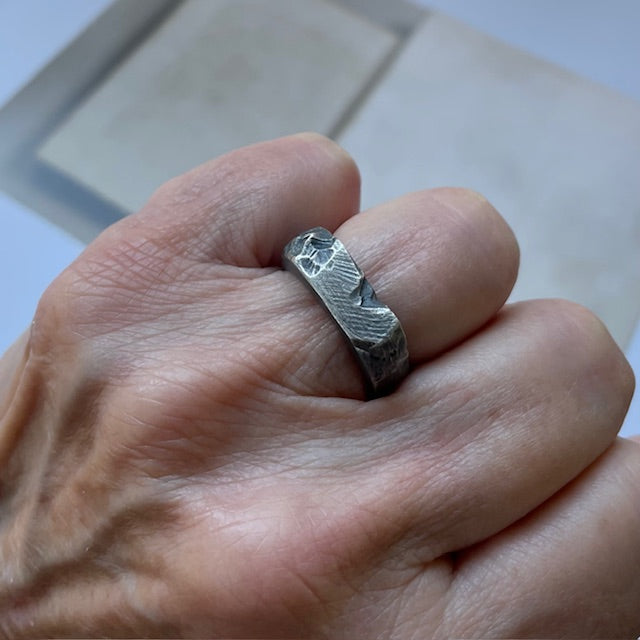 Solar Terrain Ring in silver on persons hand