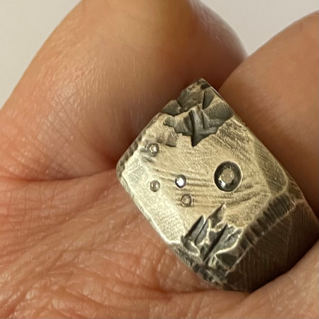 Close up of Stargazer Ring in Silver on person 