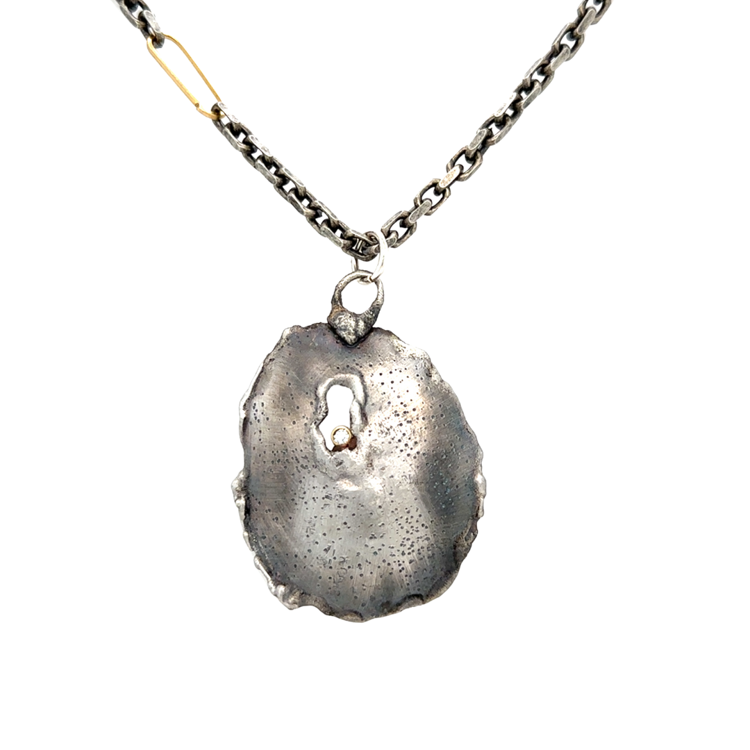 Close up of Awaken Talisman Necklace in Silver 