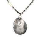 Close up of Awaken Talisman Necklace in Silver 