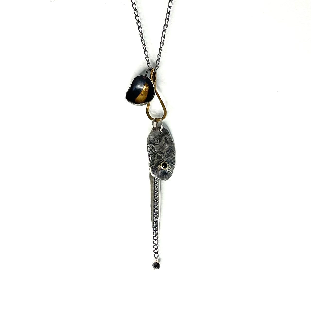 Brass Tear Drop Connector featuring the Strength with black diamond, Hope, and Truth Talisman Pendants. 