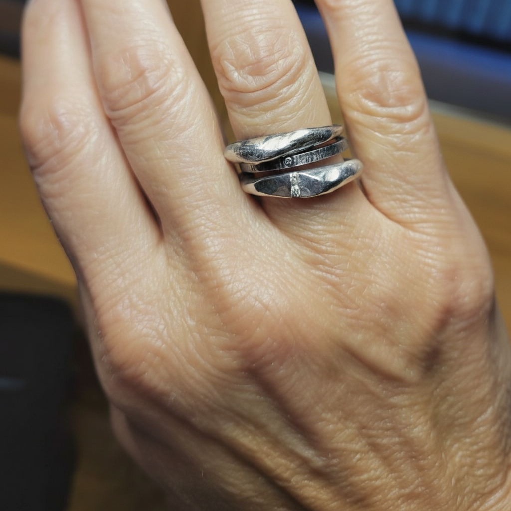 The Channel Ring in Silver shown stacked with Ritual & Element Rings in Silver on customers hand