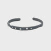 The Divine Light Cuff is a slender oxidized silver cuff illuminated with white diamonds. A symbol of serenity and luminous strength.
