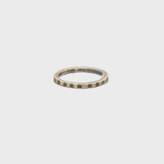 The Ritual Noir Ring glows with black diamonds and bronze texture. A talisman of grounding, strength, and quiet fire.