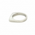 Side view of this sleek, architectural band captures that moment of clarity with its refined silhouette and single black diamond - like the dark center of an eclipse where revelation occurs in shadow.