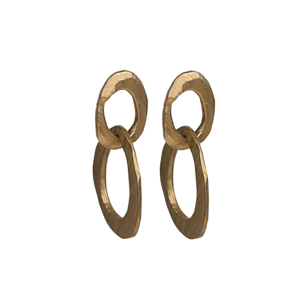 The Skipping Stones Double Oval Earrings feature two interconnected oval shapes, crafted with precision to create a fluid, harmonious design. Each pair shimmers in either Sterling Silver or Bronze with an otherworldly charm that catches both light and attention. The double oval structure allows for graceful movement, adding a dynamic element to your look. 