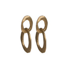 The Skipping Stones Double Oval Earrings feature two interconnected oval shapes, crafted with precision to create a fluid, harmonious design. Each pair shimmers in either Sterling Silver or Bronze with an otherworldly charm that catches both light and attention. The double oval structure allows for graceful movement, adding a dynamic element to your look. 