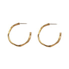 Our Small Hoop Earrings feature the same richly textured surface as their larger counterparts, evoking the weathered elegance of historic monoliths in a more subtle form. The Small Hoops are designed for versatility, perfect for everyday wear or as part of a curated ear stack.