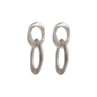 The Skipping Stones Double Oval Earrings feature two interconnected oval shapes, crafted with precision to create a fluid, harmonious design. Each pair shimmers in either Sterling Silver or Bronze with an otherworldly charm that catches both light and attention. The double oval structure allows for graceful movement, adding a dynamic element to your look. 