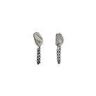 The Stone Stud with Chain Earrings feature a classic stud design, elevated by a delicate chain that drapes gracefully from the lobe. The attached chain adds movement and intrigue, creating a dynamic look that's both sophisticated and playful. Their versatile design allows for various wearing styles - traditionally in the lobe, or creatively styled up the ear for a more dramatic effect.