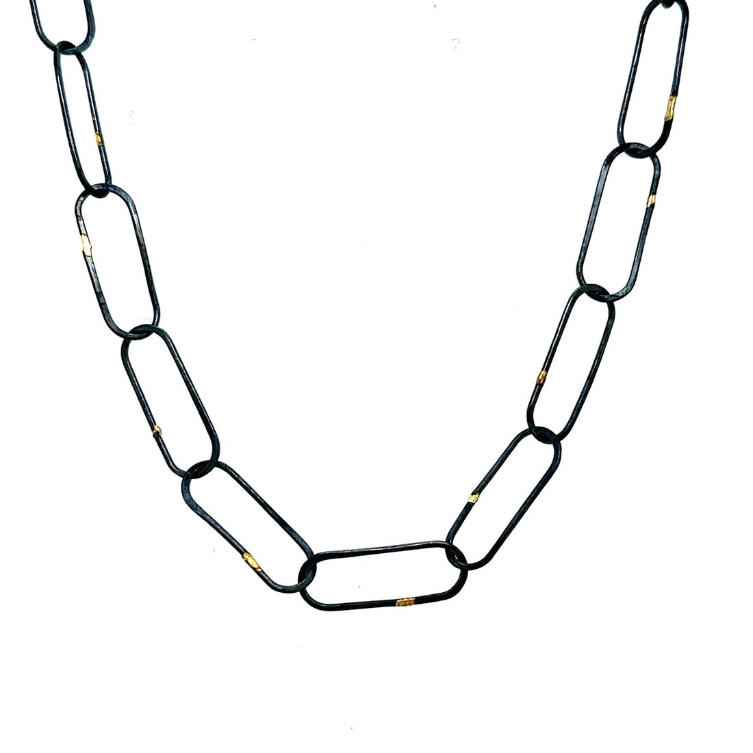 Made in our Seattle Studio, this chain is so refined. Silver links are formed, soldered, oxidized and then accented with 14kt gold. It's uncomplicated and perfect for a few Talisman. 