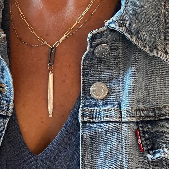 We've combined two subtle chains - one in oxidized sterling silver & the other in 14K gold-filled as a great layered necklace. You can add a few Talisman to the paperclip connector for a look that is simple and refined.